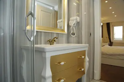 a bathroom with a sink and a shower at Art Nouveau Pera in Istanbul