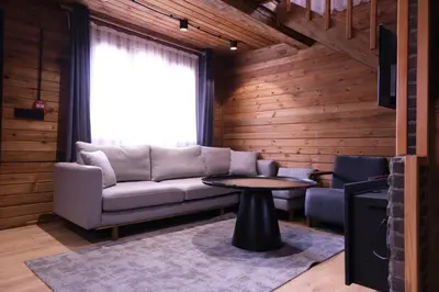 a living room with a couch and a table at Uludag Orman Koskleri in Uludag