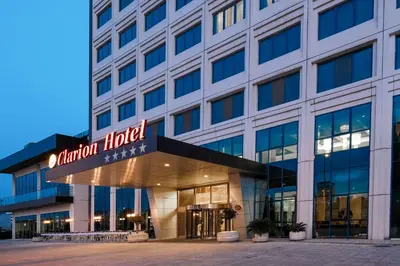 a building with a sign that reads reunion hotel at Clarion Hotel Istanbul Mahmutbey in Istanbul