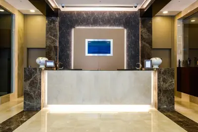 a lobby with a reception desk in a building at Park Dedeman Bostanci Hotel in Istanbul