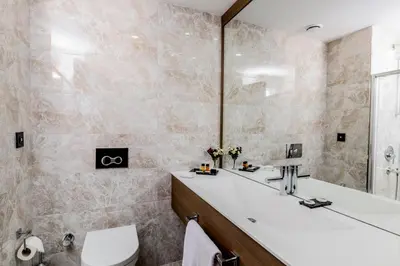 a bathroom with a tub and a toilet and a sink at Nearport Hotel Sabiha Gokcen Airport in Istanbul