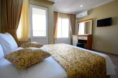 a bedroom with a bed with two pillows on it at Marida Suit - Istanbul Taksim in Istanbul