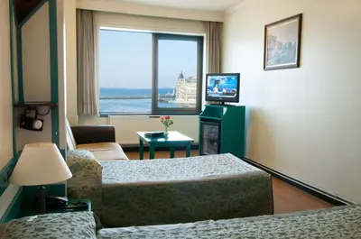 a hotel room with a bed and a window at Kadıköy Rıhtım Hotel in Istanbul
