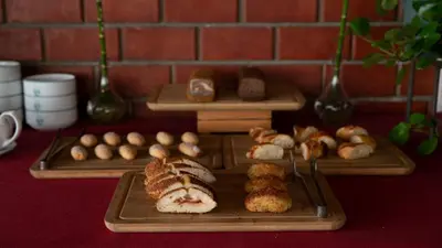a table with two trays of bread and pastries at Kadıköy Rıhtım Hotel in Istanbul