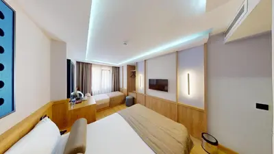 a hotel room with a bed and a television at Istanbul River Hotel in Istanbul