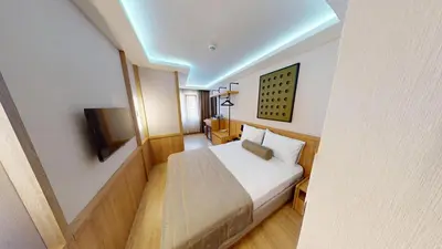 a hotel room with a bed and a television at Istanbul River Hotel in Istanbul