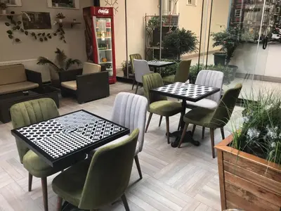 a restaurant with tables and chairs in a room at Niconya Port Suite&Hotel in Istanbul
