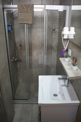 a bathroom with a shower and a sink at Niconya Port Suite&Hotel in Istanbul