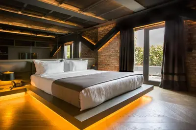 a bedroom with a large bed and a large window at Cityloft 81 in Istanbul