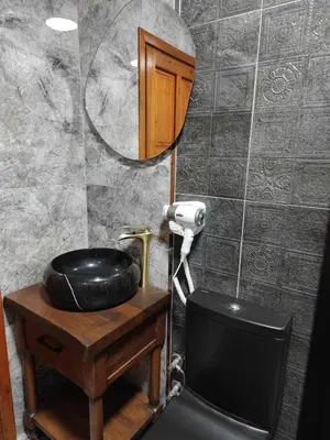 a bathroom with a black sink and a mirror at Star Hotel in Istanbul