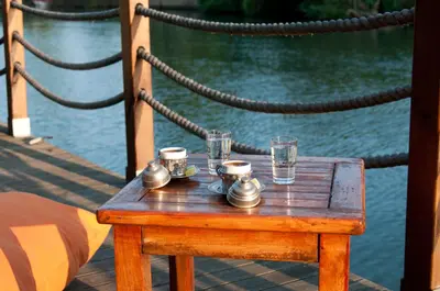 a wooden table with cups and glasses on it at Agva Nehir Evi - Adult Only in Agva