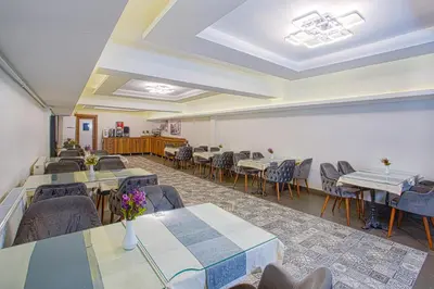 a dining room with tables and chairs and a room with tables and chairs at Sim Hotel Istanbul Old City in Istanbul