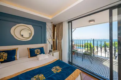 a bedroom with a bed and a balcony at The Byzantium Suites Hotel & Spa in Istanbul