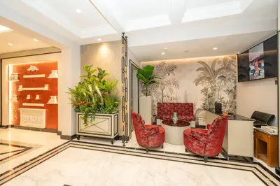 an office with red chairs and a desk at The Byzantium Suites Hotel & Spa in Istanbul