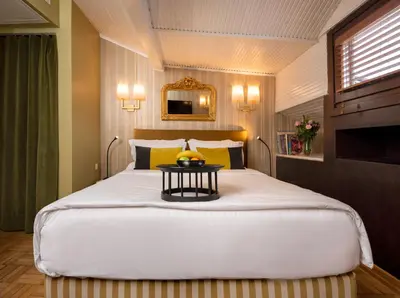 a bedroom with a large bed with a table on it at Hotel Ibrahim Pasha in Istanbul