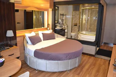 a bedroom with a large bed in a room at Gumus Palace Suites in Istanbul