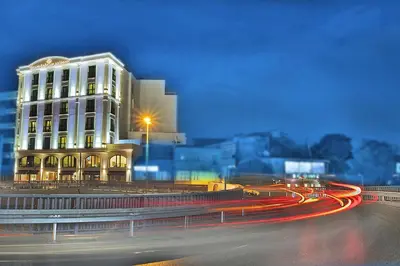 a building with lights in front of a street at Grand Sagcanlar Hotel in Istanbul