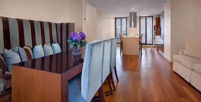 a living room with a table and a couch at Galateia Residence in Istanbul