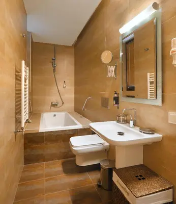 a bathroom with a sink and a toilet and a tub at Galateia Residence in Istanbul