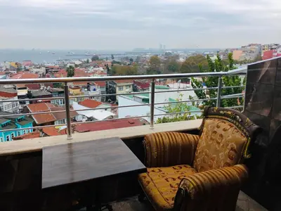 a balcony with a table and a chair and a view at Art City Hotel Istanbul in Istanbul