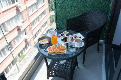 a table with a tray of breakfast food on a balcony at Taksim Hotel V Plus in Istanbul