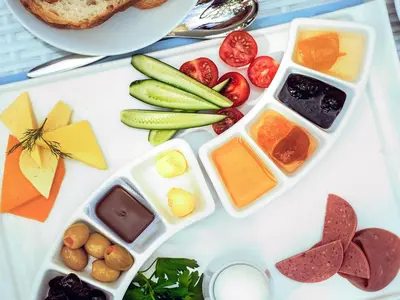 a tray filled with different types of food on a table at Taksim Hotel V Plus in Istanbul