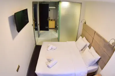 a room with a bed with two towels on it at Taksim Hotel V Plus in Istanbul