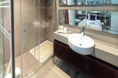 a bathroom with a sink and a shower at Golden Pars Hotel in Bursa