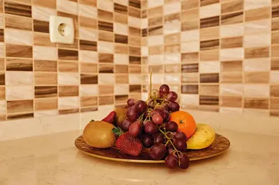 a plate of fruit sitting on a table at Bursa Suites Apart Otel in Bursa