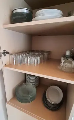 a shelf with plates and bowls and other dishes at Charming Anatolian House in Çengelköy in Istanbul
