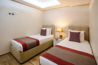 two beds in a small room with sidx sidx sidx at Cheya Sisli BNB Medical & Business City Center Tesvikiye Suites and Apartments in Istanbul