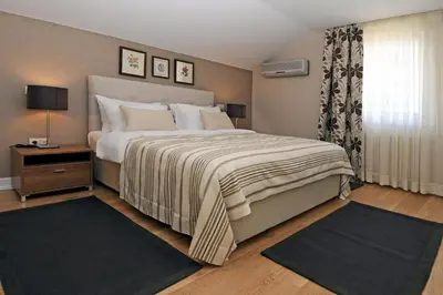 a bedroom with a large bed and a window at Cheya Sisli BNB Medical & Business City Center Tesvikiye Suites and Apartments in Istanbul