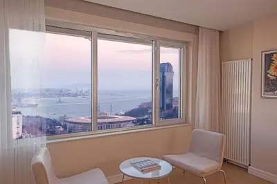 a room with a window with a view of a city at Cheya Deluxe Residence Nisantasi Istanbul City Center in Istanbul