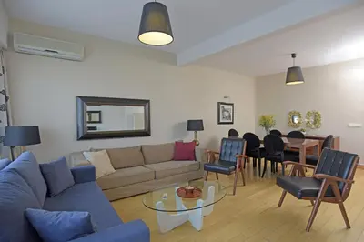 a living room with a couch and a table at Cheya Taksim BNB Gumussuyu Istanbul City Center Comfort Residence in Istanbul