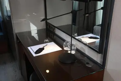 a glass counter with a plate and a knife on it at Hotel La Villa in Istanbul