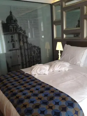 a bedroom with a bed with a picture of a building at Hotel La Villa in Istanbul