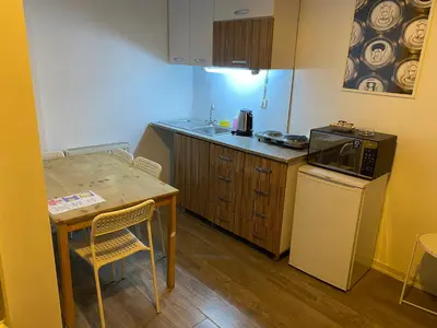 a small kitchen with a table and a microwave at Flats Company - Karakoy Apartment in Istanbul