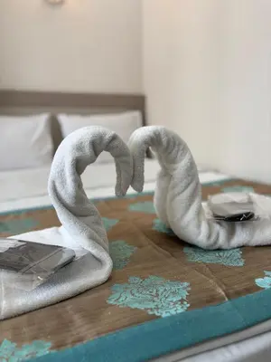 two towelsrendered to look like swans on a bed at Fly Hotel in Istanbul