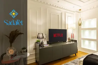 a living room with a television on a cabinet at Sadaret Hotel-Old City Sultanahmet in Istanbul