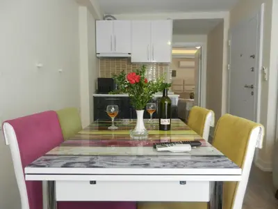 a dining room table with flowers and wine glasses at Best Home Suites Sultanahmet in Istanbul