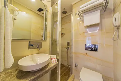 a bathroom with a sink and a shower at Grand Naki Hotel in Istanbul