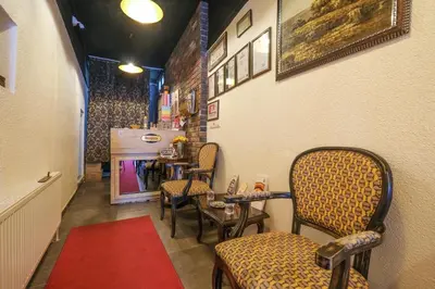 a waiting room with chairs and a red rug at Loren Hotel&Suites in Istanbul