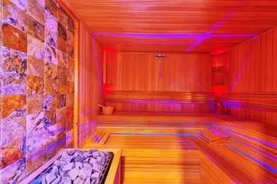 a sauna with red and blue lights in a room at MARE PARK Hotel & SPA in Istanbul