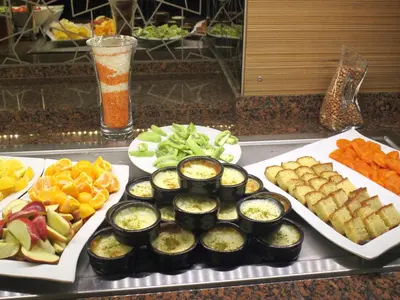 a buffet with plates of food on a table at MARE PARK Hotel & SPA in Istanbul