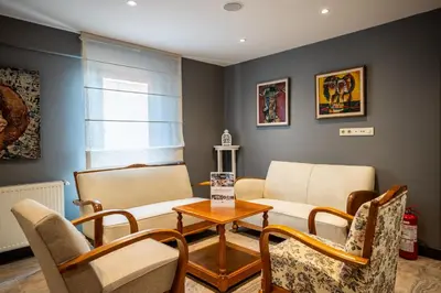 a living room with a couch and chairs at Tiara Buyukada in Buyukada