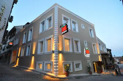 a large building with flags on the side of it at Apple Tree Hotel in Istanbul