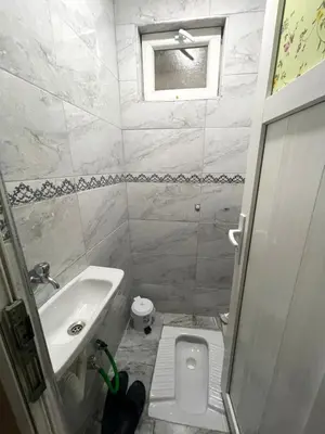 a small bathroom with a sink and a toilet at Villa Park Apart in Istanbul