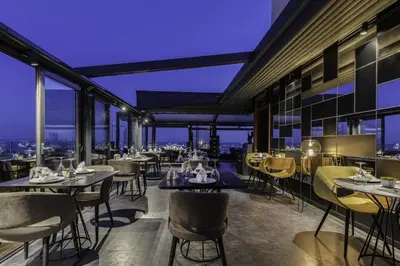 a restaurant with tables and chairs at night at Hotel Venera Istanbul Old City in Istanbul