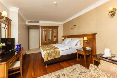 a hotel room with a bed and a couch at Acra Hotel - Special Category in Istanbul