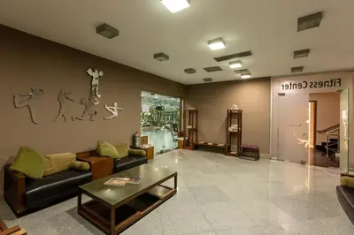 a living room with a couch and a table at Nippon Hotel in Istanbul